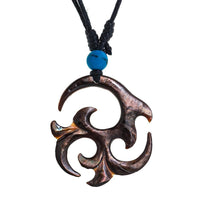 Load image into Gallery viewer, A hand-carved Tomoe pendant from glossy black shell hangs on an adjustable unisex cotton necklace with a turquoise bead. Product name: Halskette Perlmutt verstellbar Baumwolle Muschel Kette handgeschnitzt Türkis Stein Tomoe.
