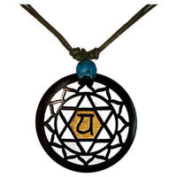 Load image into Gallery viewer, The Holzkette Türkis verstellbar Baumwolle Anhänger filigran features a round wood pendant with a geometric mandala and yellow Sanskrit symbol, plus a blue bead on an adjustable cotton cord, making it an ideal unisex accessory.
