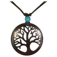Load image into Gallery viewer, The Holzkette Türkis verstellbar aus Baumwolle hat einen filigranen, runden Holzanhänger mit Baum-Motiv und eine türkise Perle – einzigartiger Unisex Schmuck.
