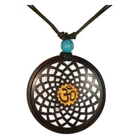 Load image into Gallery viewer, The Holzkette Türkis verstellbar Baumwolle Anhänger filigran is a round wooden necklace with an intricate design, gold Om symbol center, and a turquoise bead above the pendant on an adjustable cord for unisex style.
