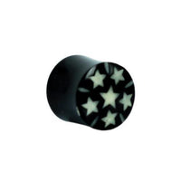 Load image into Gallery viewer, The Horn Plug Bone Inlay features a black buffalo horn design with white star inlays, arranged in a circle around a central star for a unique tribal look—perfect as an organic expander tunnel.
