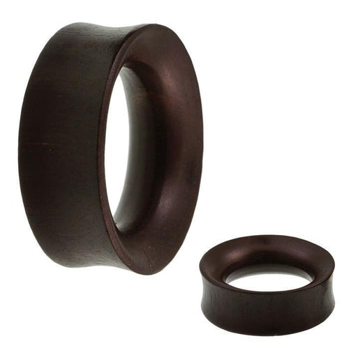 Two hand-carved black ironwood Holz Tunnel plugs, slim with rounded edges and an organic hourglass design—ideal as tribal-style Expander jewelry for those seeking unique, handmade Holztunnel piercings.