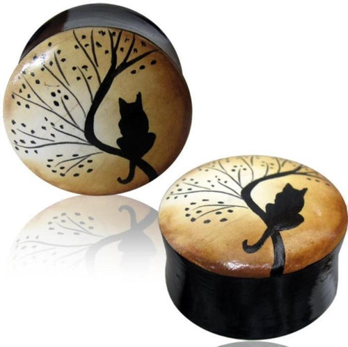 The Holz Plug handbemalt Baum Katze schwarz braun features a black cat silhouette on a tree branch with leaves against a beige gradient, in a tribal-inspired, hand-painted design on the surface of each handcrafted organic tunnel.