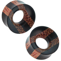 Cargar imagen en el visor de la galería, Two circular hand-carved Holz Tunnel Plugs with black Eisenholz stripes and reddish-brown Kokosholz spots, perfect for a Tribal look—unique Expander in brown and black.
