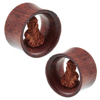 Load image into Gallery viewer, Two unisex wooden rings, each featuring a hand-carved Buddha Tunnel motif from the "Holz Tunnel braun hell dunkel Buddha sitzend Tribal Plug handgeschnitzt Expander Organic," are shown side by side on a white background.
