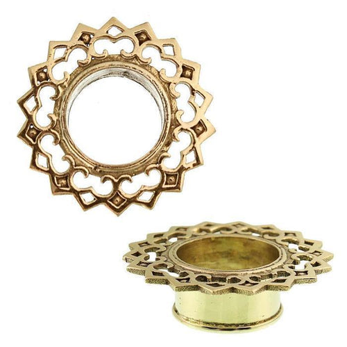 Two views of the Brass Tunnel Rauten Bögen Plug in antique gold, made from nickel-free brass. Features an ornate, lacy floral design with an open circular center; one view shows the top, the other the side.