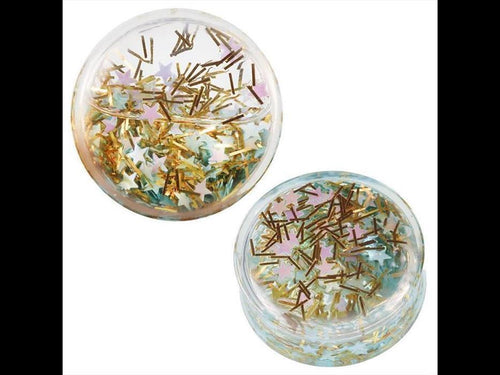 Two small transparent Acryl Plug Flüssigkeit Expander containers, filled with gold glitter and turquoise star confetti, are shown on a white background.