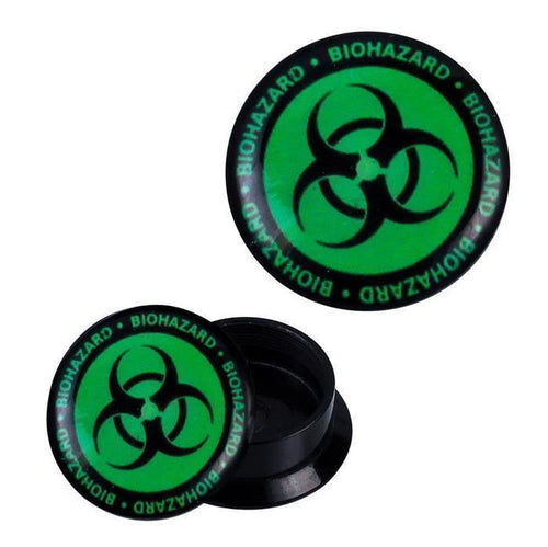 A round black Schraub Plug Acryl Biohazard ear expander with a green screw-on lid, bold black biohazard symbol, and "BIOHAZARD" in green lettering circling the lid. Ideal for piercing jewelry.