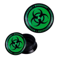 Load image into Gallery viewer, A round black Schraub Plug Acryl Biohazard ear expander with a green screw-on lid, bold black biohazard symbol, and "BIOHAZARD" in green lettering circling the lid. Ideal for piercing jewelry.
