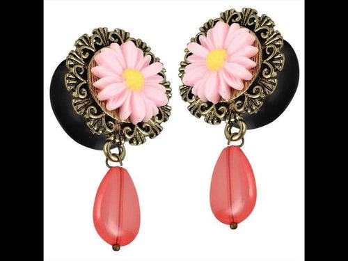 A pair of Plug Acryl earrings with yellow-pink flower design, golden brass edge, pink glass teardrop pendant—ideal for fans of Blume Schmuck and delicate floral style.
