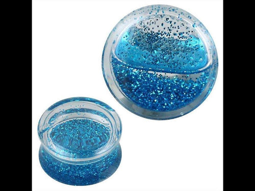 Two Plug Acryl transparent Piercing Ohrschmuck pieces, filled with blue liquid and Glitzer, shown from side and top views against a white background.