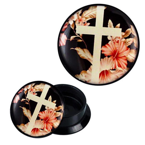 An open Schraub Plug Acryl Piercing in black with a white cross and pink hibiscus flowers on a dark background. The container, labeled "rosa beige weiß Kreuz vor Blumen," is round and shows its empty interior.