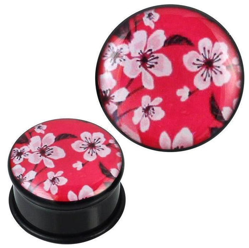 The single flared Plug Acryl Gummiring features a black base with a red top, adorned with white cherry blossom flowers and black branches—making this pink and black Kirschblüten Ohrschmuck a striking, unique piercing accessory.