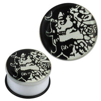 Load image into Gallery viewer, The single flared Plug Acryl Gummiring weiß schwarz Hexe Piercing Ohrschmuck features a black and white abstract witch face with flowing hair on its circular surface, secured by a black rubber ring.
