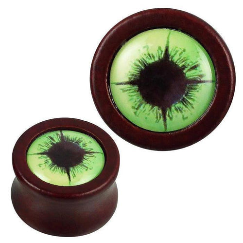 Two round, reddish-brown Holz Plugs named "Holz Plug rotbraun Auge hellgrün schwarz Acryl Inlay Tribal Piercing," each featuring a light green eye design with a black acrylic inlay in the center.