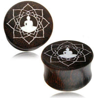 Load image into Gallery viewer, These Holz Plug Tamarinde Bone Inlay Lotussitz Blume handgeschnitzt Tribal Tunnel Expander ear plugs showcase a white meditating figure in a lotus flower design, finely engraved for a unique tribal style.
