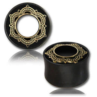 Load image into Gallery viewer, A pair of Holz Tunnel Eisenholz Lotus Brass Inlay golden handgeschnitzt Tribal Plug Expanders with ornate gold mandala designs, shown on a white background with a reflection underneath.

