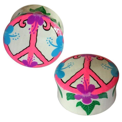 Two circular teak wood plugs with a pink peace sign, purple and blue Hawaii flowers, and green leaves on white. Holz Plug Peace Hawaii Blumen—unique organic Ohrschmuck for tunnel ohrringe fans seeking standout designs.