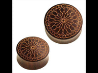 Load image into Gallery viewer, Two round Holz Plugs "Blütenblatt Mandala Blume" from Sonoholz in dark brown, handgefertigt with golden gravur, displayed against a white background.

