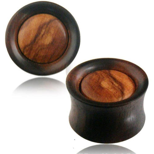 These Plug Arangholz dunkel Olivenholz hell gemasert Mitte Tunnel Tribal Expanders feature a dark Arangholz rim, a lighter Olivenholz center with natural grain, rounded edges, and a polished, organic finish.