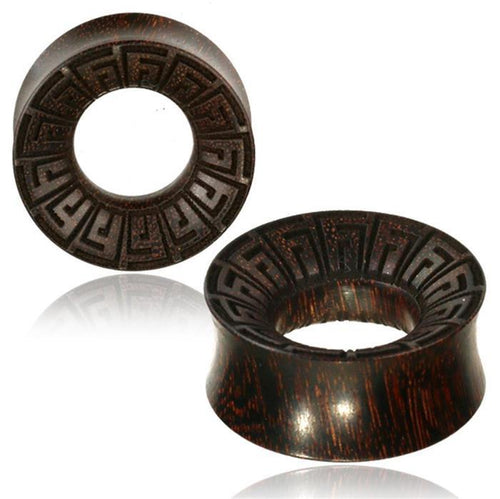 Two dark brown Tamarindenholz Flesh Tunnel griechisch Ornament Spiralen with flared edges, an engraved geometric spiral pattern on the inner rim, and a natural wood grain texture. One tunnel stands upright while the other lies flat.