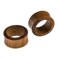 Load image into Gallery viewer, Two round, hollow Flesh Tunnel Teakholz Sawoholz Rim rot double flared wooden rings with smooth surfaces and visible wood grain are shown on a white background—one upright, the other on its side.
