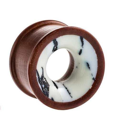 The Holz Tunnel Howlith weiß braun marmoriert Rosenholz Tribal Plug is a hand-carved expander featuring a white and brown marbled inlay for a distinctive flesh tunnel style.