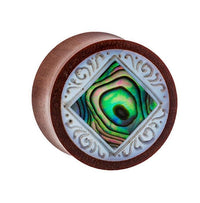 Load image into Gallery viewer, The Organic Sabaholz Plug features a rounded design with a diamond-shaped Paua Abalone Perlmutt inlay and detailed white tribal engravings, inspired by the "Paua Abalone eckig gerahmt Perlmutt Tunnel Tribal Expander.
