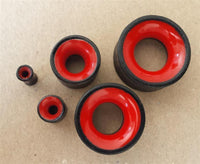 Load image into Gallery viewer, Five Flesh Plug Eisenholz Holz dunkel double flared rot Resin Inlay Ohr Piercing plugs, resembling organic piercing jewelry, are arranged on a plain brown surface.
