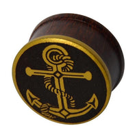 Load image into Gallery viewer, The Plug Holz Tamarinde in dark brown features an anchor and rope design with a brass gold-plated rim—perfect as a unique piercing accessory.
