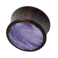 Load image into Gallery viewer, The Holz Plug Sonoholz lila schillernd Resin Inlay double flared is a round plug with a flat face inlaid with shimmering purple resin, featuring an iridescent finish.

