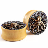 Load image into Gallery viewer, The Holz Plug Oktopus Krake Bild beige hell double flared set features round plugs with an ornate octopus design and detailed tentacles, displayed on a white background.
