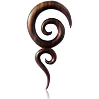 Load image into Gallery viewer, The Sonoholz lang Tribal Piercing Holz zwei Spiralen handmade features a dark wooden spiral pendant with curved, swirling shapes and a polished finish, making it a bold Organic Tribal Piercing ideal as Piercingschmuck Ohrloch on white background.
