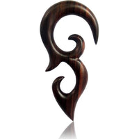 Load image into Gallery viewer, The Sonoholz lang Tribal Piercing Holz Bögen Ornament features a dark wooden, tribal-style pendant with smooth curves and pointed ends, its swirling abstract design evoking an elegant hand-carved look against a white background.
