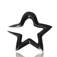 Load image into Gallery viewer, A glossy, black Tribal Buffalo Horn Piercing Expander in a rounded star shape rests on a white background, its smooth reflective surface and slight rightward tilt highlighting the stylish "Stern rund Plug Ohrhänger Ohrstecker" design.
