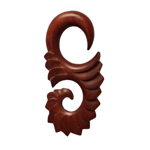 A hand-carved red sawo wood earring with an abstract S-form tribal design, perfect as a Piercing Holz Expander Dehner and stylish Ohrschmuck.