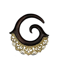 Load image into Gallery viewer, The Piercing Dehnschnecke Narraholz Brass Ornament Spirale is a decorative, spiral-shaped wooden stretching accessory with a pointed tip and ornate brass detailing—ideal for lobe piercing enthusiasts.

