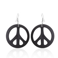 Load image into Gallery viewer, A pair of large, round, 50 mm Holzohrringe in a colorful peace design with stainless steel, nickel-free hooks are displayed against a white background.
