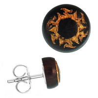 Load image into Gallery viewer, The Holzohrstecker Edelstahl Sonoholz rund 8mm features a gold sunburst motif engraved on dark wood, completed with a stainless steel post for an elegant, natural look.
