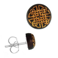 Load image into Gallery viewer, The Holzohrstecker Edelstahl Sonoholz rund 8mm gold Motive features a round dark brown base with an intricate gold Celtic knot-like design and a silver post, shown from both front and side views.
