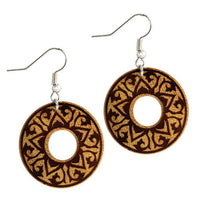 Load image into Gallery viewer, These round Ohrringe Jackfrucht Holz feature intricate dark brown floral and swirl engravings, a central open circle, and elegant stainless steel silver hooks for comfortable wear.
