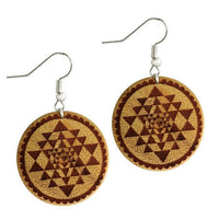Load image into Gallery viewer, A pair of round Ohrringe Jackfrucht Holz with intricate mandala-inspired engravings in brown tones, crafted from jackfruit wood and featuring stainless steel silver hooks for pierced ears.
