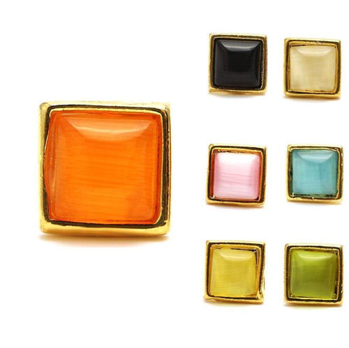 Six colorful square brass Ohrstecker (nickelfrei, 12 mm) in orange, black, cream, pink, teal, and yellow with subtle Stern Motiv are displayed on a white background. Unisex Edelstahl Ohrringe inspired by Kommunismus.