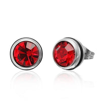 Load image into Gallery viewer, The CHICNET Brass Ohrstecker silber features 10mm round faceted red Glaskristall gemstones in a bezel setting, shown on a white background.
