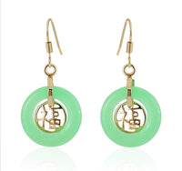 Load image into Gallery viewer, A pair of Brass Ohrringe Ohrhänger Ohrschmuck Damen earrings with round cat's eye hoops and intricate brass designs, all crafted from nickel-free materials.
