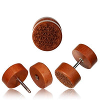 Load image into Gallery viewer, Four round wooden Ohrstecker with metal posts, named "Fake Motiv Holz Plug Piercing Edelstahl Lebensbaum Lebensblume Om Shivaauge," display carved geometric flower-of-life patterns and are shown from various angles.
