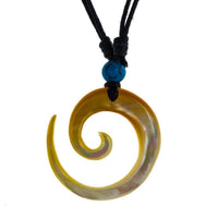 Load image into Gallery viewer, The Halskette Perlmutt features a hand-carved Tomoe Muschel Anhänger with a Türkis Stein on an adjustable black cotton cord, adding stylish flair to any look.
