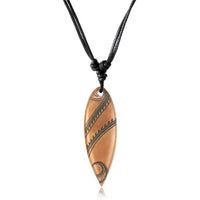 Load image into Gallery viewer, The Surferkette Holz Halskette features a long, engraved leaf-shaped pendant on an adjustable black cotton cord with knot closures.
