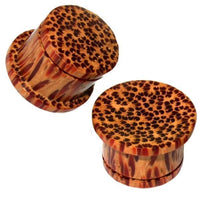 Load image into Gallery viewer, Two single flared Holzplug Kokosholz braun Plugs, hand-carved with a black and red pattern in Tribal style. Made of brown wood with light and dark streaks—unique Ohrschmuck Tunnel Plugs.
