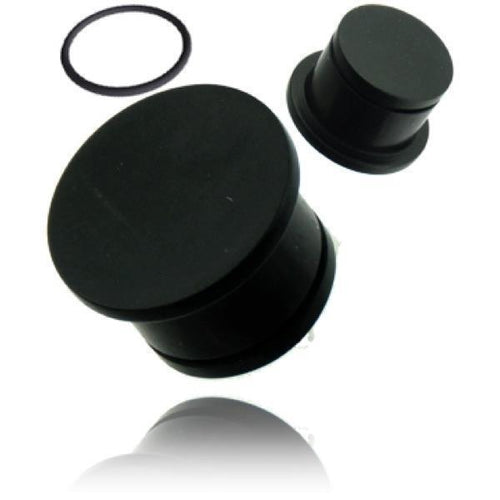 Three black rubber cylinder-shaped items—two differently sized solid stoppers and a thin O-ring—are displayed on white, comparable in function to the Tribal Plug schwarz single flared Eisenholz konkav Holzplug handgeschnitzt Tunnel Expander.